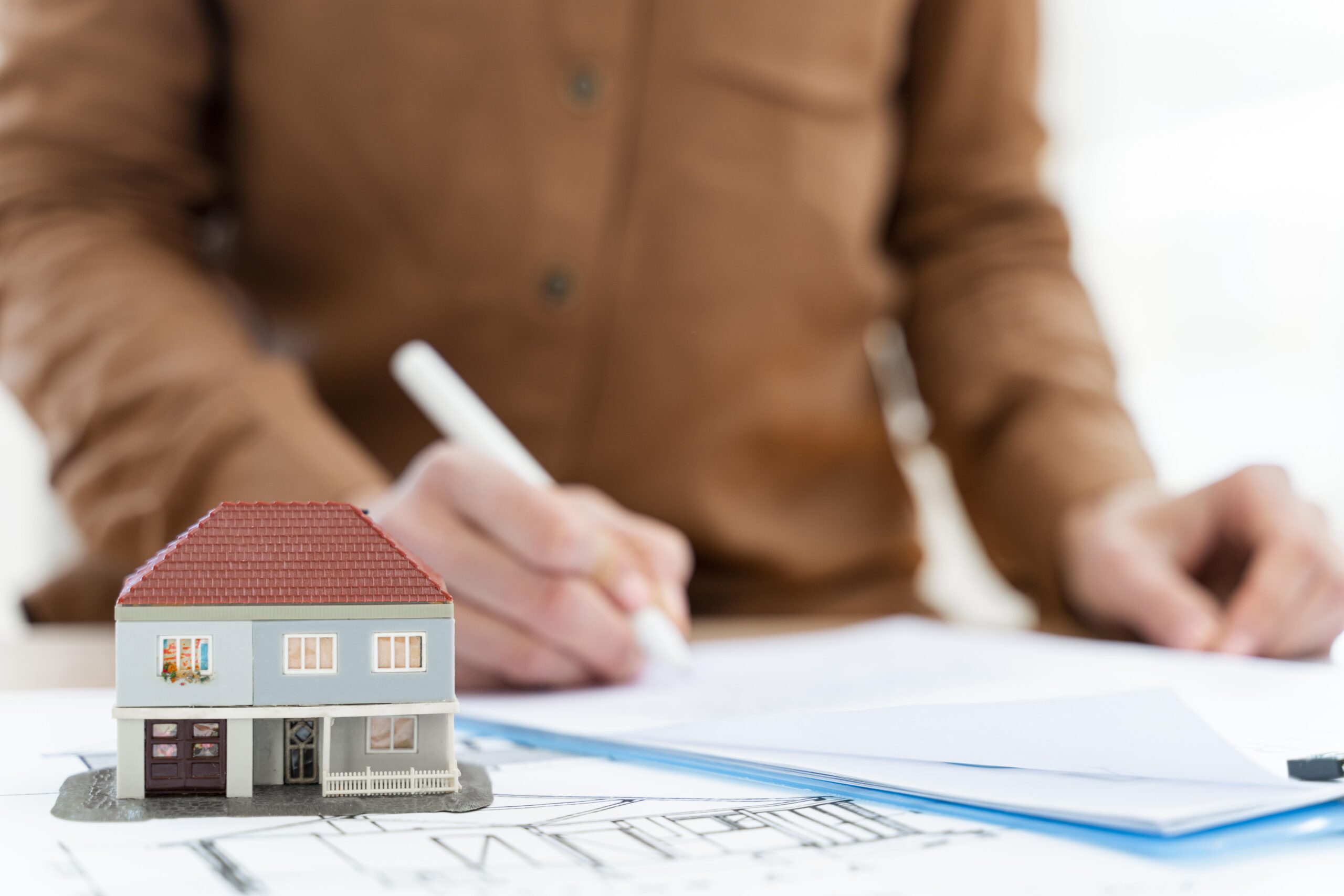 Services realtor signing contract clipboard miniature house